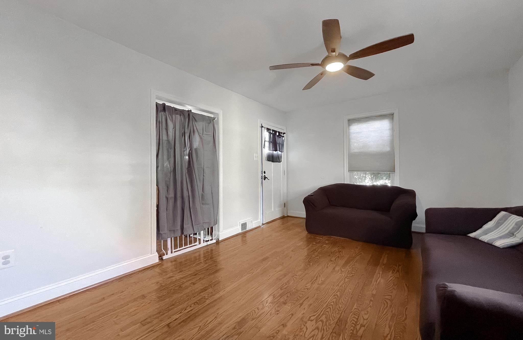 31 Governor's Gate Lane Linthicum, MD 21090 - Photo 6 of 34 a living room with furniture and a ceiling fan
