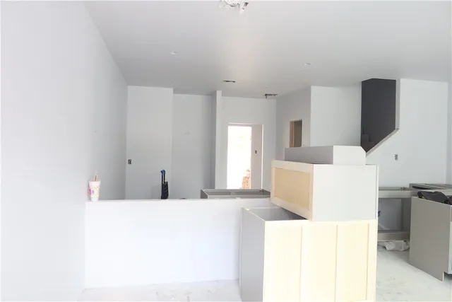 a living room with a couch and a flat screen tv