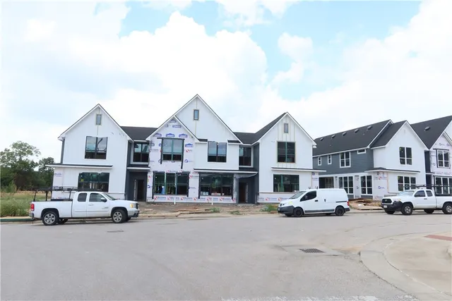 a view of a city street with a large building
