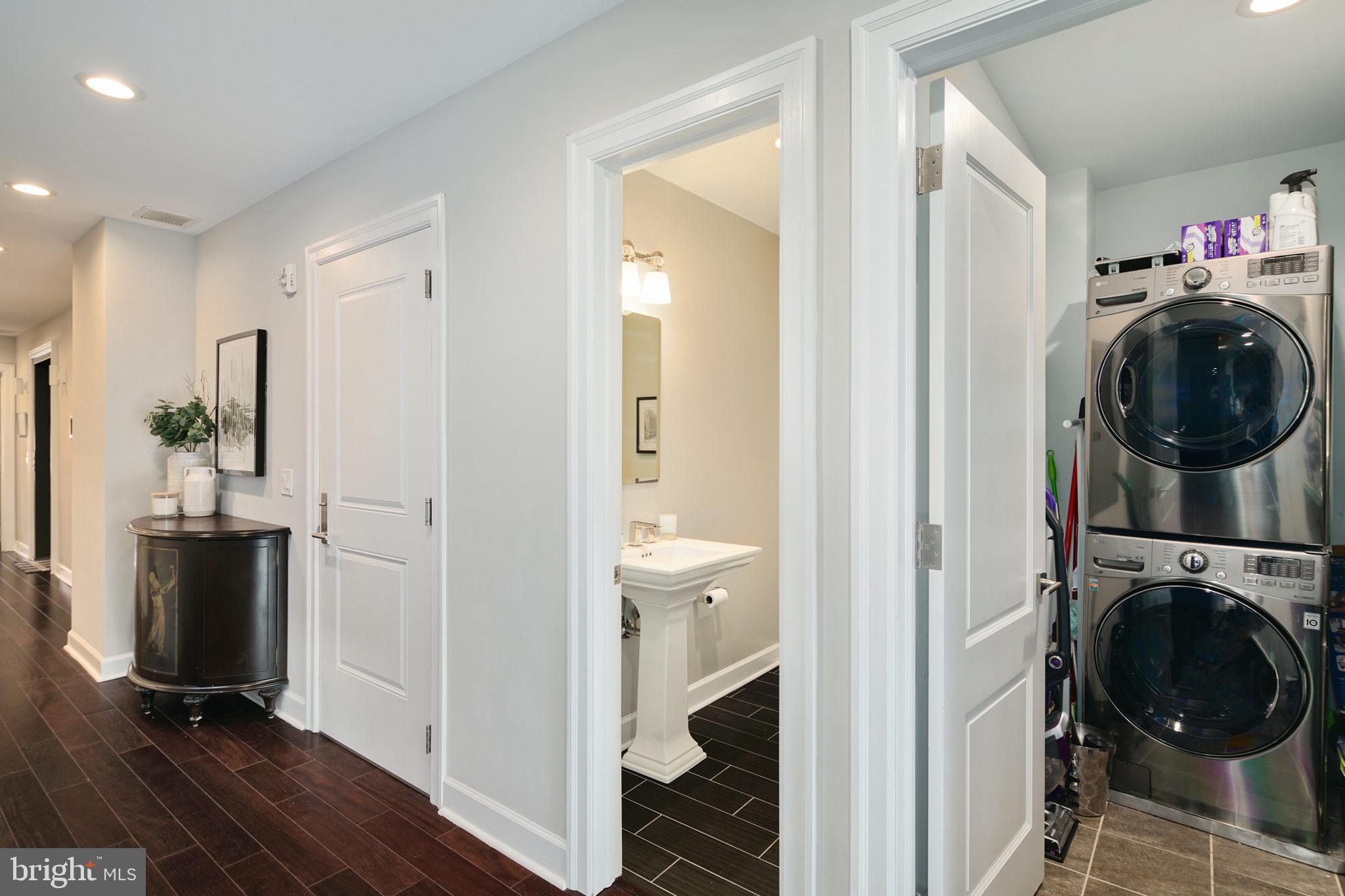 1910 Spring Garden Street, Unit 2 Philadelphia, PA 19130 - Photo 15 of 36 a view of a hallway with washer and dryer