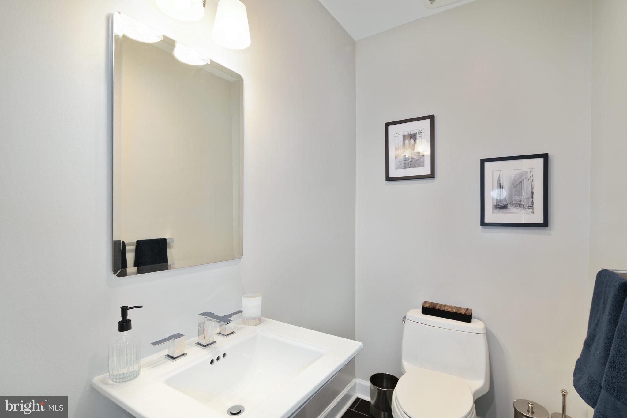 1910 Spring Garden Street, Unit 2 Philadelphia, PA 19130 - Photo 16 of 36 a bathroom with a toilet sink and mirror