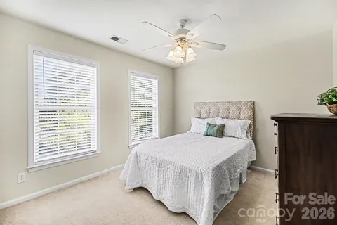 an aerial view of a house with table and chairs