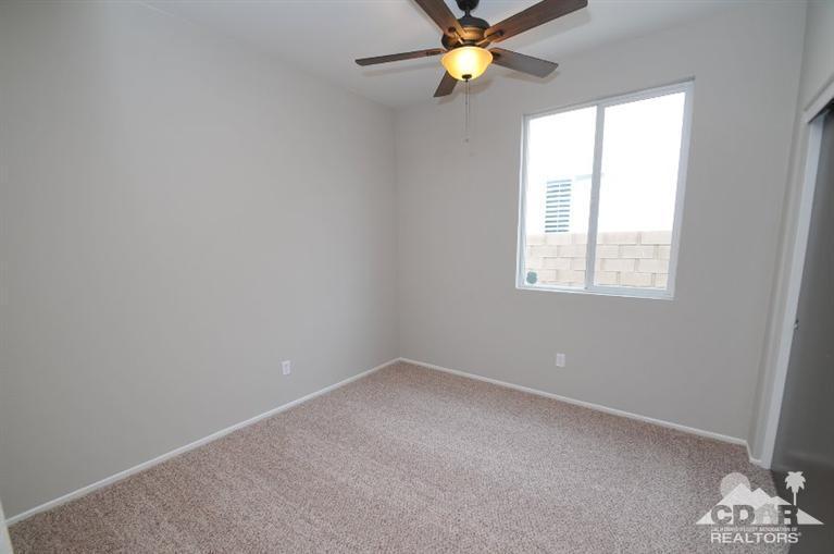 47534 Stampede Trail Indio, CA 92201 - Photo 13 of 17 an empty room with a window