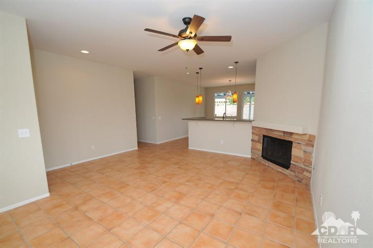 47534 Stampede Trail Indio, CA 92201 - Photo 3 of 17 a view of an empty room with a fireplace