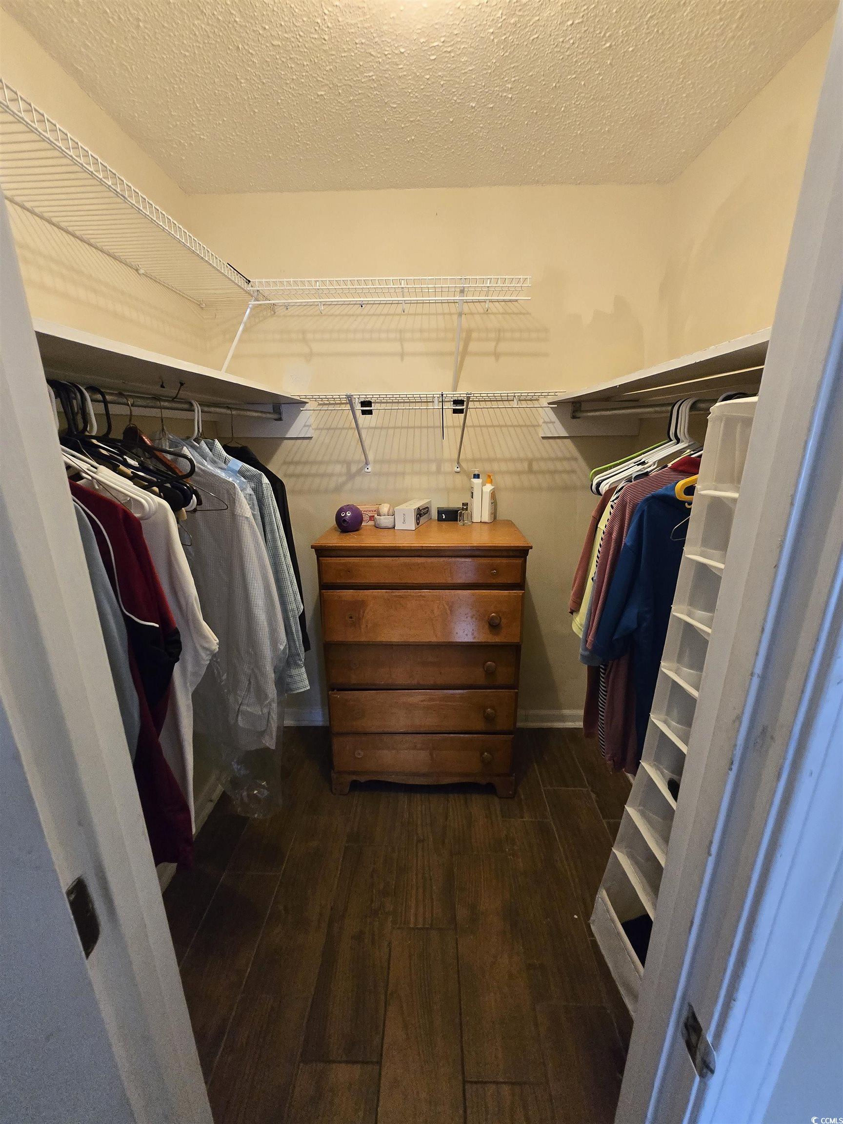 604 35th Avenue North, Unit A Myrtle Beach, SC 29577 - Photo 5 of 10 Walk in closet featuring dark wood finished floors