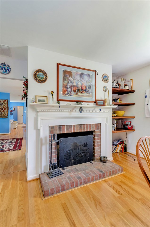 3354 Free Union Road Charlottesville, VA 22901 - Photo 11 of 45 a view of a livingroom with a fireplace and workspace