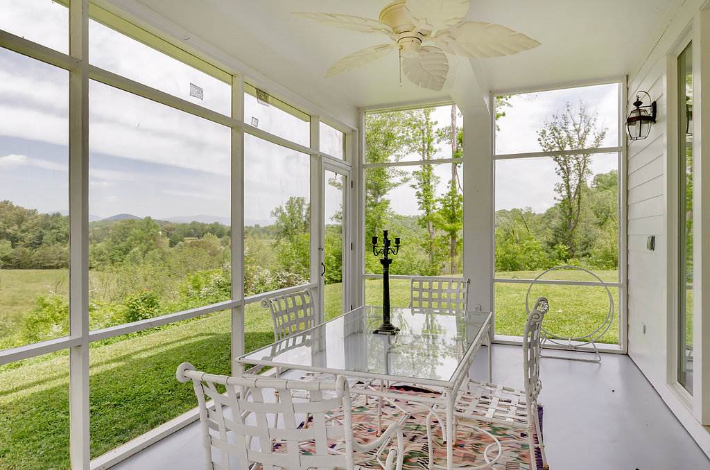 3354 Free Union Road Charlottesville, VA 22901 - Photo 16 of 45 a view of a room and balcony with a big yard