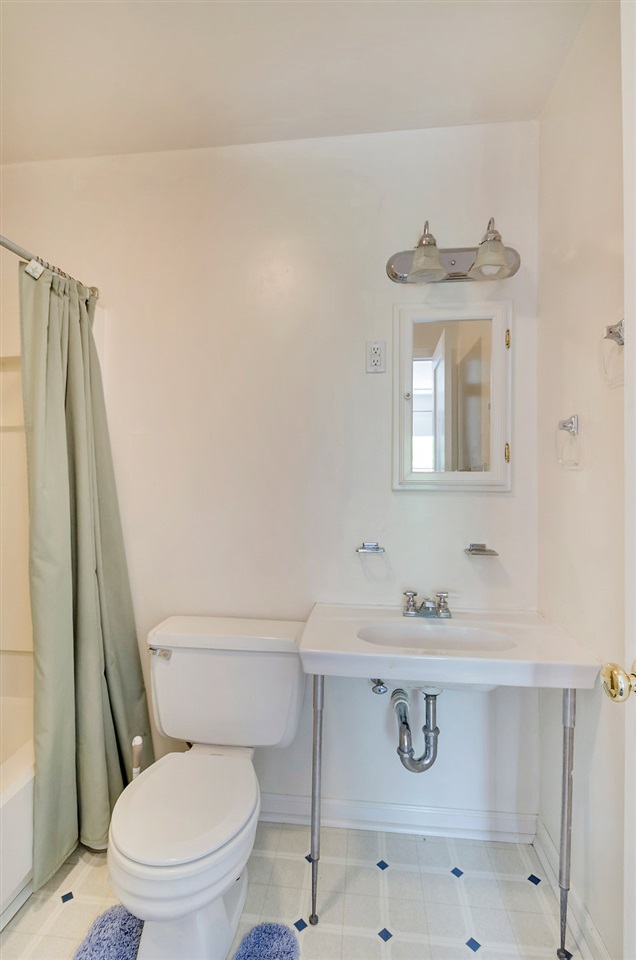 3354 Free Union Road Charlottesville, VA 22901 - Photo 25 of 45 a white toilet sitting next to a bathroom sink