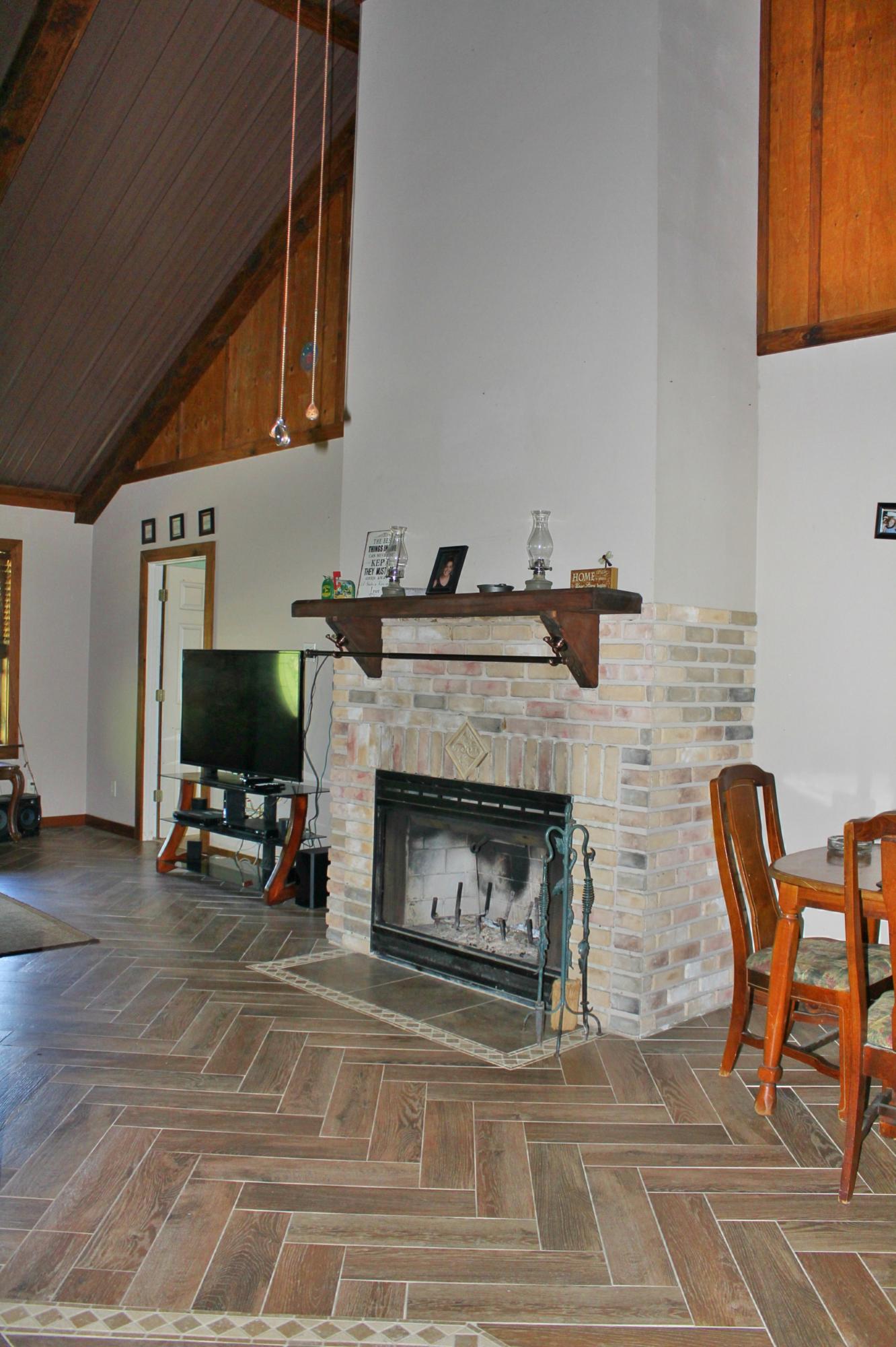 2913 King Lake Road DeFuniak Springs, FL 32433 - Photo 9 of 31 a living room with furniture and a fireplace