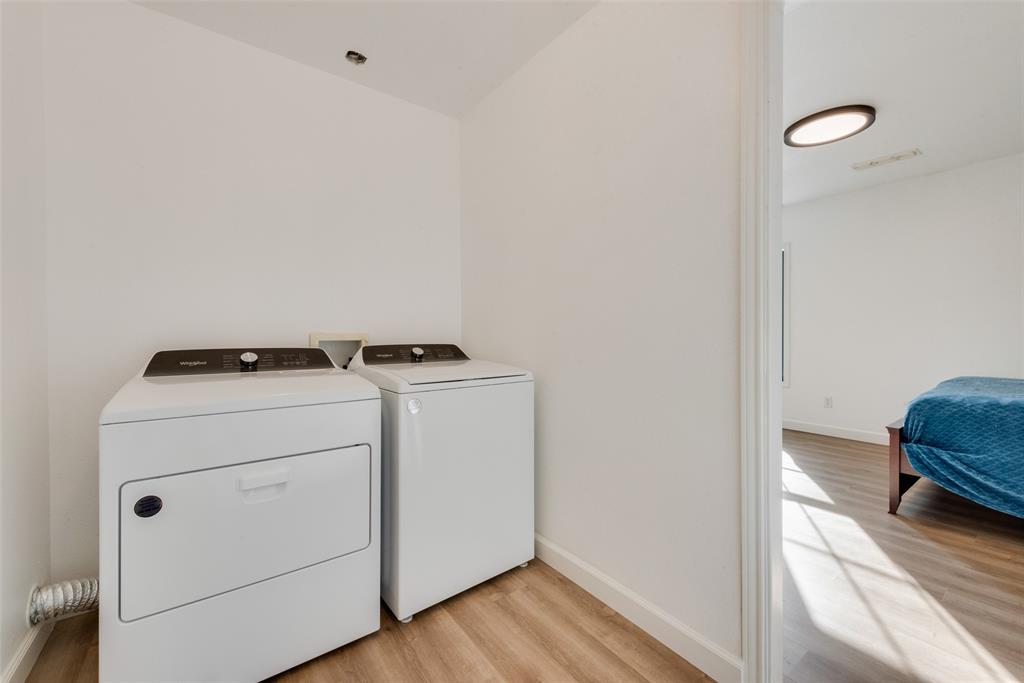 207 West Walnut Street Nocona, TX 76255 - Photo 9 of 22 a utility room with dryer and washer