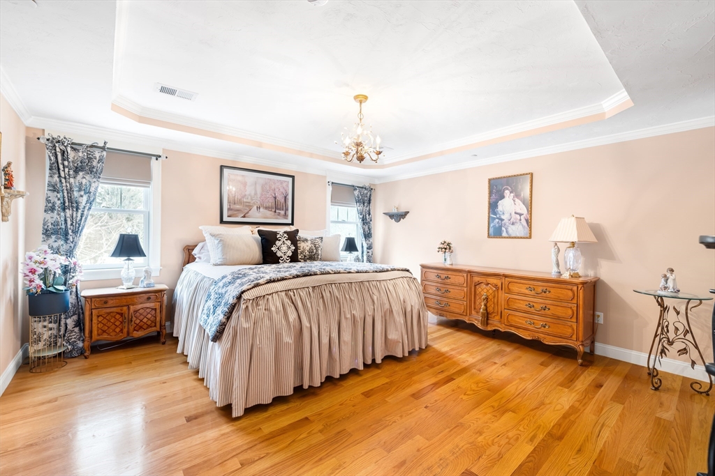 192 Boston Post Road, Unit 8 Sudbury, MA 01776 - Photo 13 of 27 a spacious bedroom with a bed and a dresser