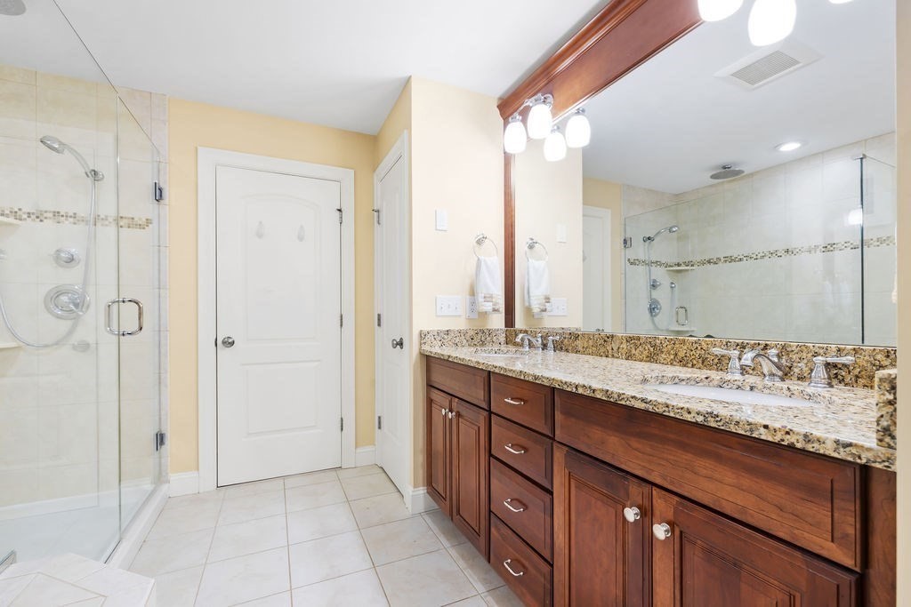 192 Boston Post Road, Unit 8 Sudbury, MA 01776 - Photo 15 of 27 a bathroom with a granite countertop sink and a mirror