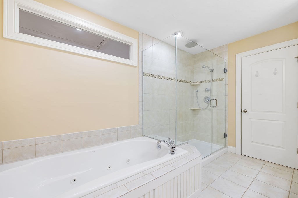 192 Boston Post Road, Unit 8 Sudbury, MA 01776 - Photo 16 of 27 a bathroom with a bathtub and a shower