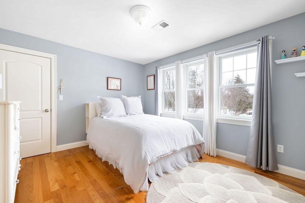 192 Boston Post Road, Unit 8 Sudbury, MA 01776 - Photo 17 of 27 a bedroom with a bed and a large window