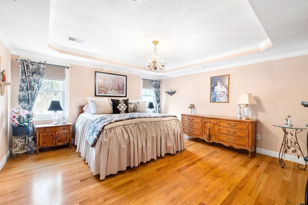 192 Boston Post Road, Unit 8 Sudbury, MA 01776 - Photo 2 of 27 a spacious bedroom with a bed and a dresser