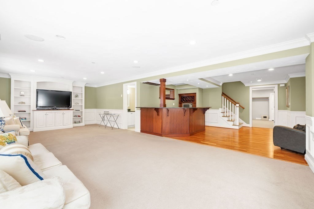 192 Boston Post Road, Unit 8 Sudbury, MA 01776 - Photo 22 of 27 a living room with furniture and a flat screen tv