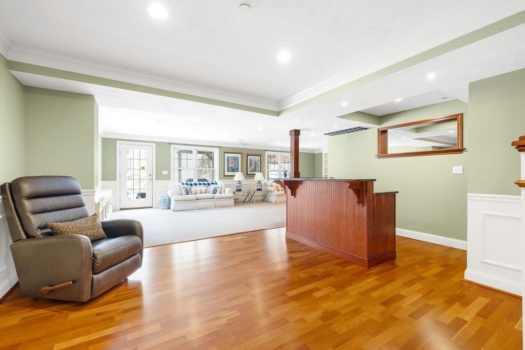 192 Boston Post Road, Unit 8 Sudbury, MA 01776 - Photo 23 of 27 a living room with furniture and a large window