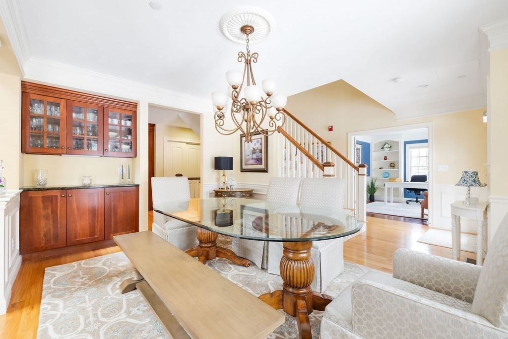 192 Boston Post Road, Unit 8 Sudbury, MA 01776 - Photo 10 of 27 a living room with couches a dining table and chairs with wooden floor