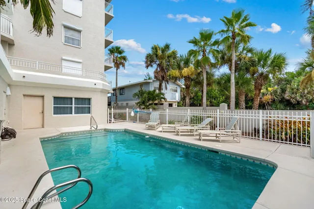 a view of a house with backyard porch and sitting area
