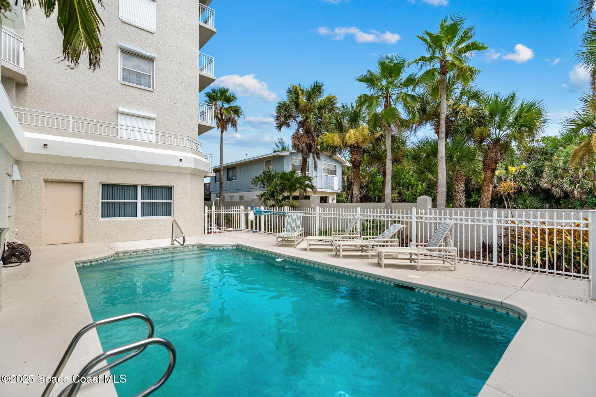 1155 South Atlantic Avenue, Unit 203 Cocoa Beach, FL 32931 - Photo 13 of 41 a view of a house with backyard porch and sitting area