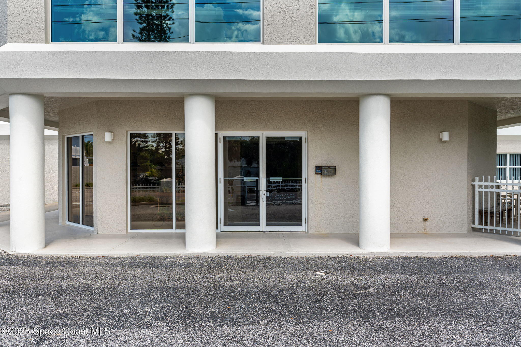 1155 South Atlantic Avenue, Unit 203 Cocoa Beach, FL 32931 - Photo 35 of 41 front view of a house with a large window