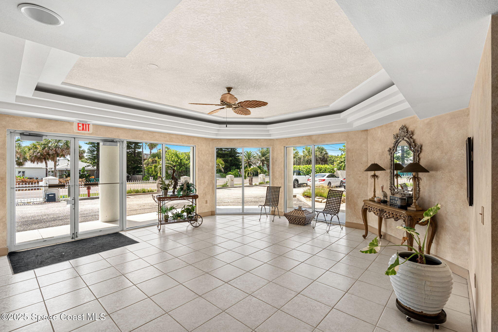 1155 South Atlantic Avenue, Unit 203 Cocoa Beach, FL 32931 - Photo 36 of 41 a living room with furniture and a large window