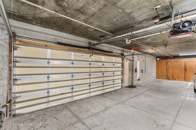 a view of an empty room with a garage