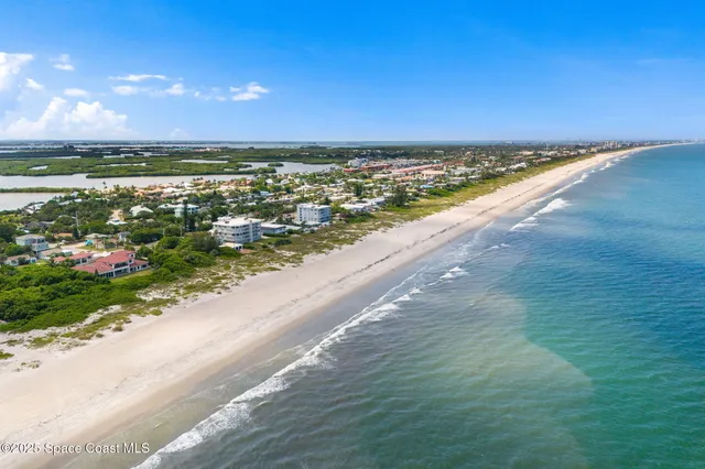 a view of an ocean and city