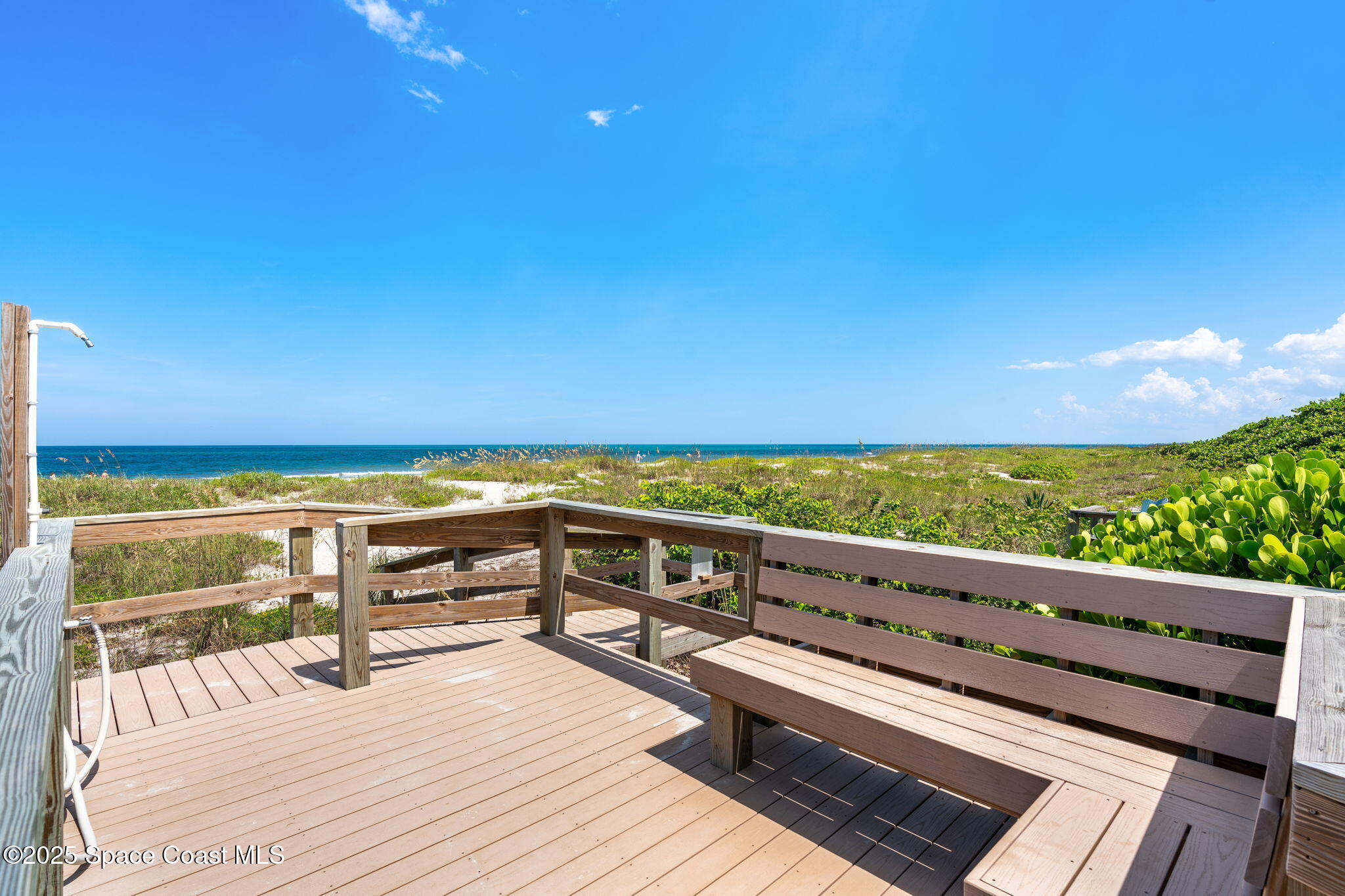 1155 South Atlantic Avenue, Unit 203 Cocoa Beach, FL 32931 - Photo 9 of 41 a view of roof deck with wooden floor and outdoor seating