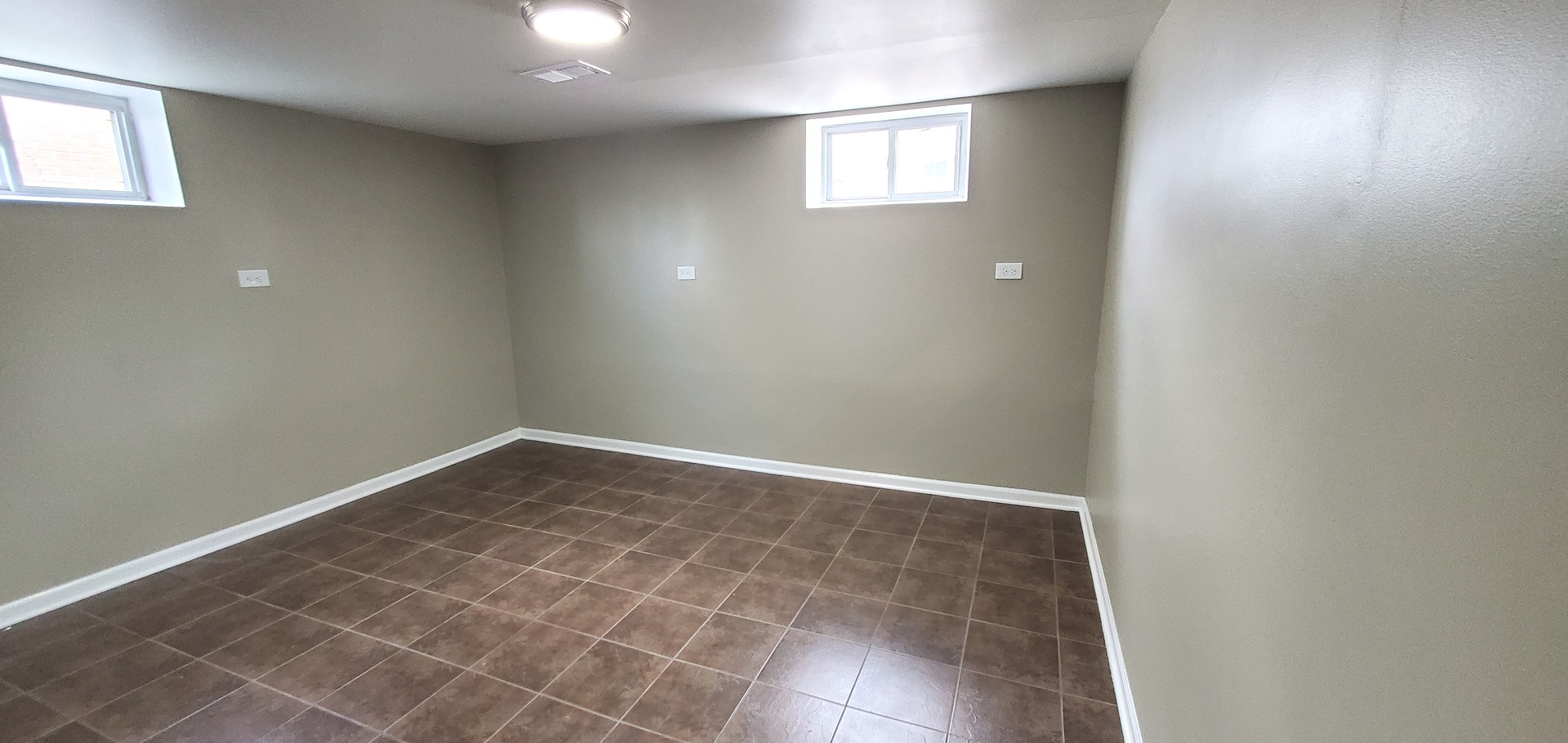 1241 Howard Avenue Berkeley, IL 60163 - Photo 11 of 14 an empty room with windows