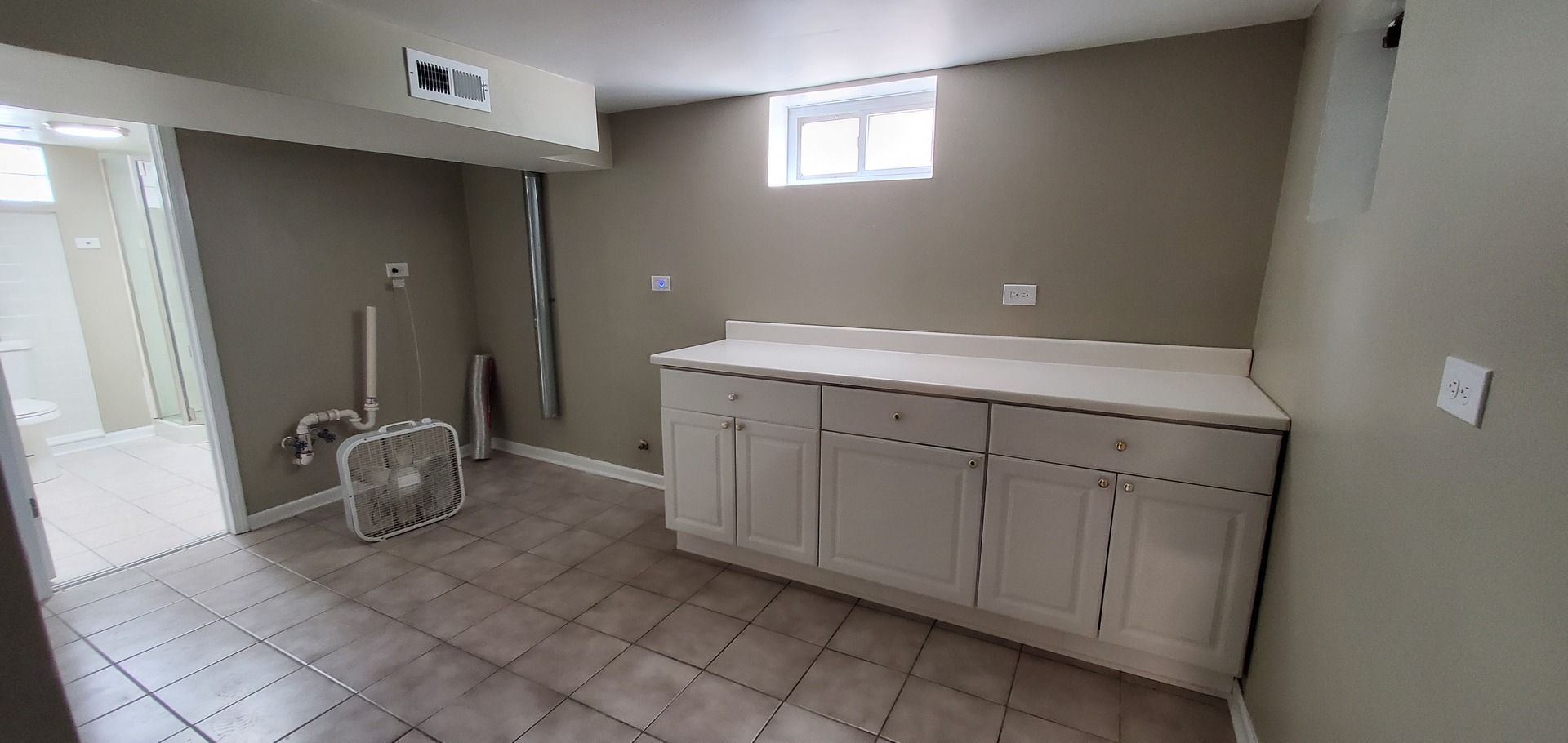 1241 Howard Avenue Berkeley, IL 60163 - Photo 12 of 14 a room with washing machine