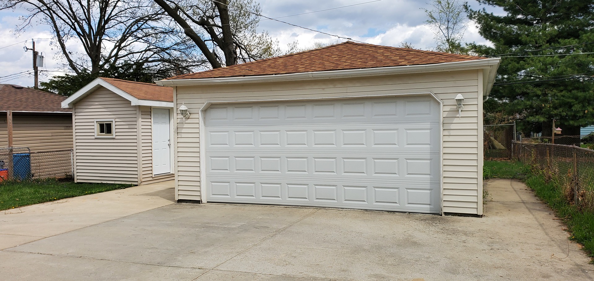 1241 Howard Avenue Berkeley, IL 60163 - Photo 14 of 14 a small white house with a outdoor space