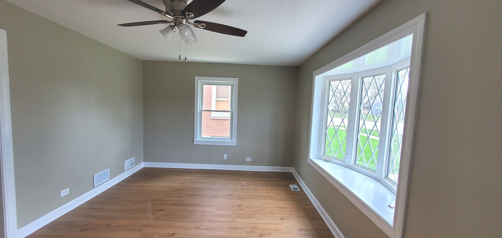 1241 Howard Avenue Berkeley, IL 60163 - Photo 2 of 14 a view of an empty room with a window