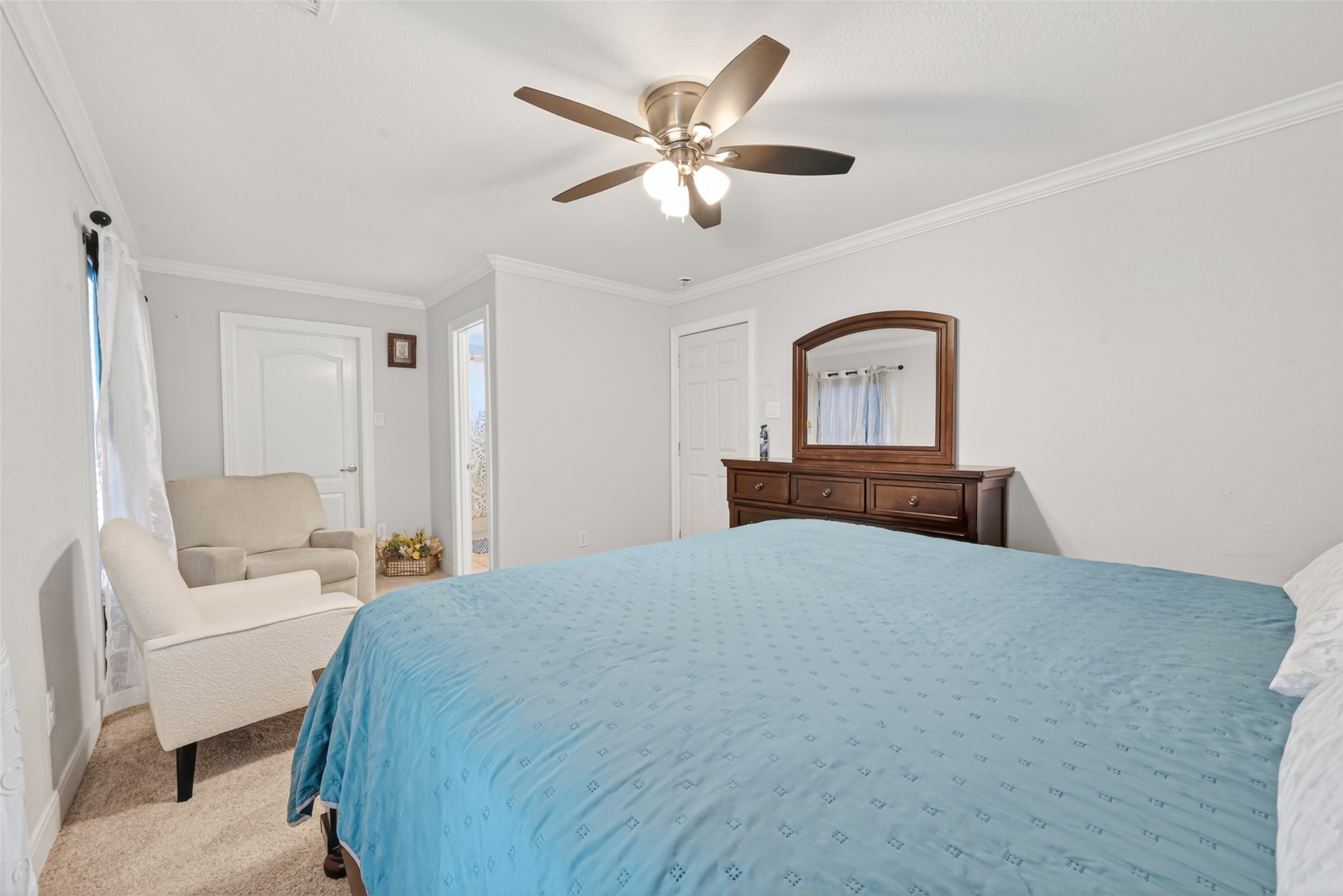 8023 Pool Hill Road Fulshear, TX 77441 - Photo 39 of 50 a bedroom with a bed and a chandelier