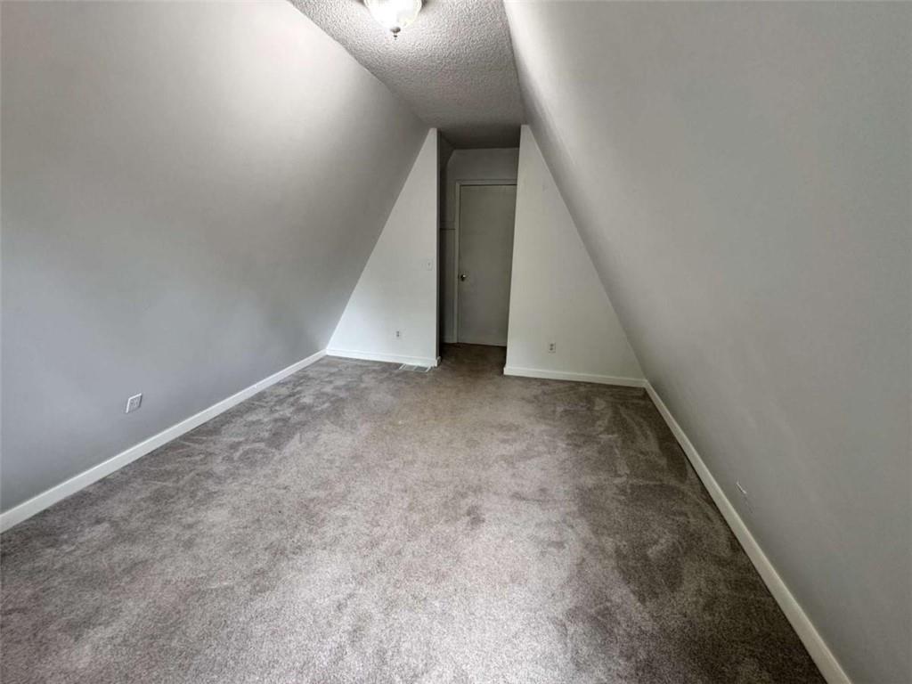 2475 Hawk Creek Trail Cumming, GA 30041 - Photo 20 of 24 a view of an empty room with stairs