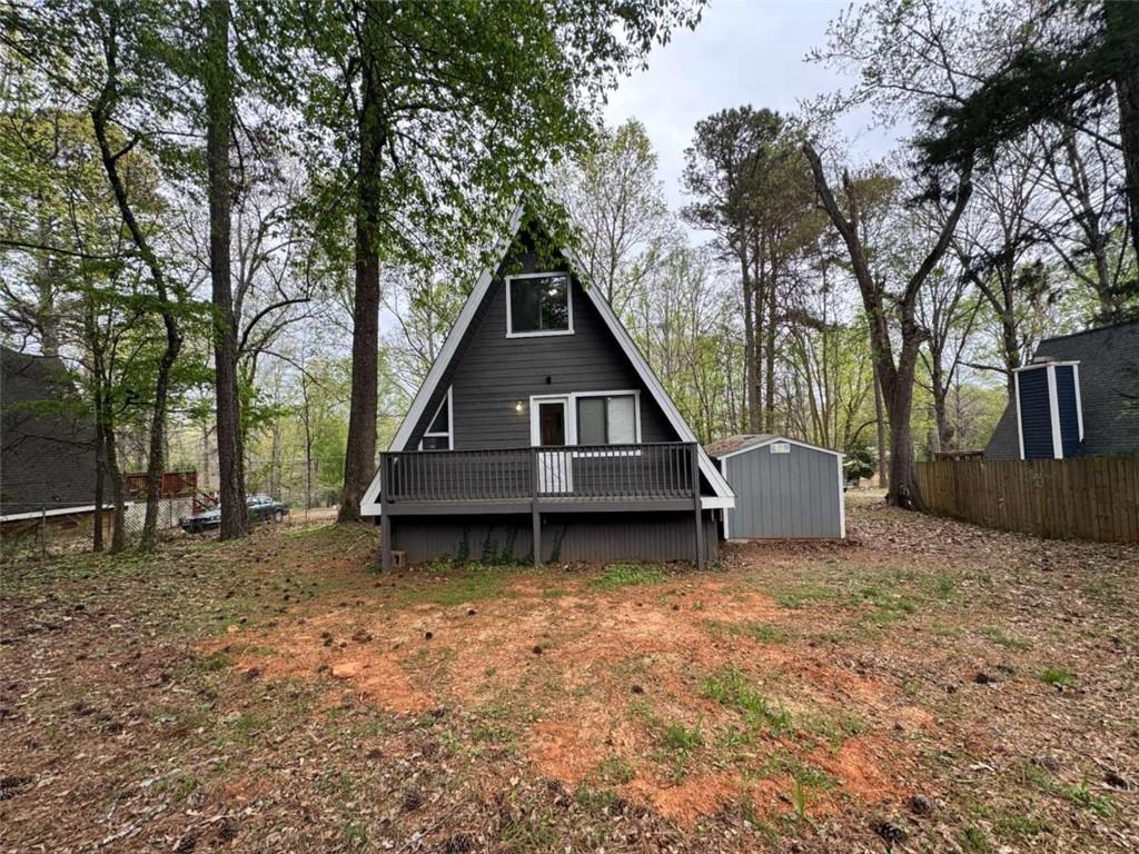 2475 Hawk Creek Trail Cumming, GA 30041 - Photo 23 of 24 a house with trees in front of it