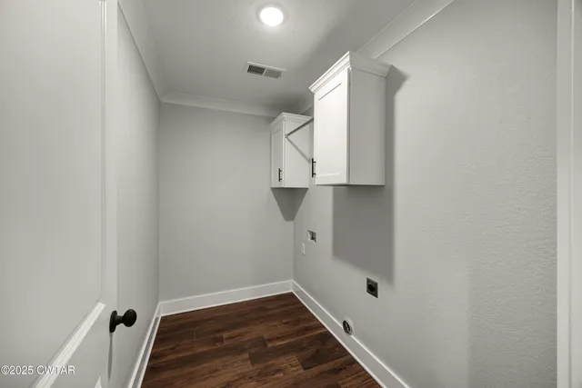 a view of a hallway with a wooden door