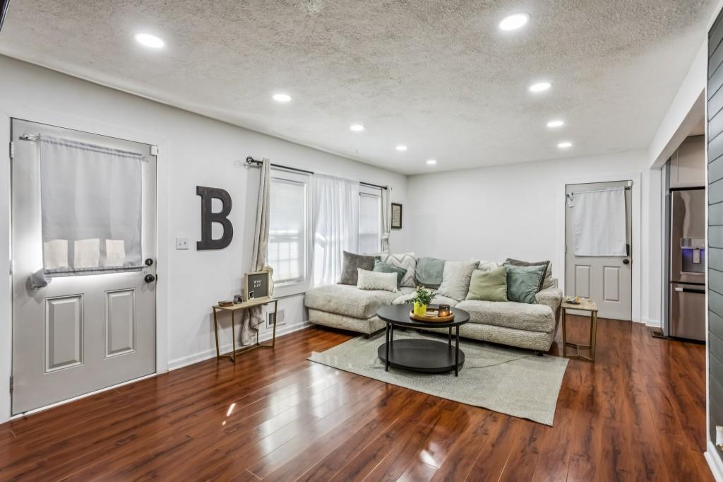 5430 Carol Circle Southwest Mableton, GA 30126 - Photo 12 of 32 a living room with furniture and a wooden floor
