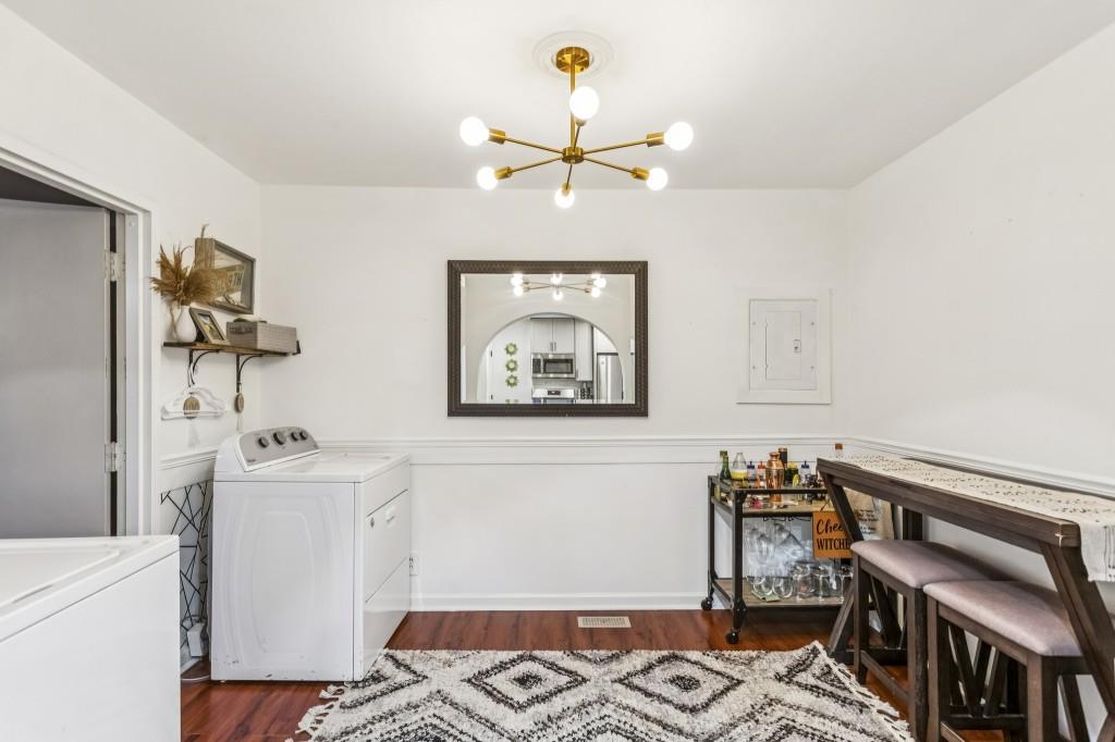 5430 Carol Circle Southwest Mableton, GA 30126 - Photo 16 of 32 a bedroom with a bed and wooden floor