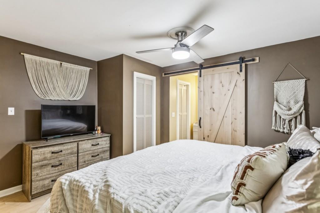 5430 Carol Circle Southwest Mableton, GA 30126 - Photo 18 of 32 a bedroom with a bed and a flat screen tv