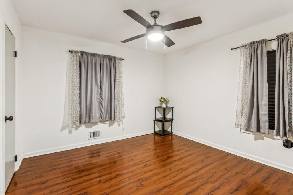 5430 Carol Circle Southwest Mableton, GA 30126 - Photo 20 of 32 wooden floor in an empty room with a window