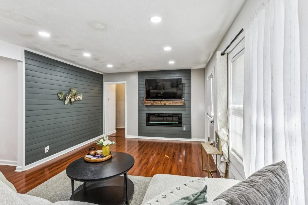 5430 Carol Circle Southwest Mableton, GA 30126 - Photo 2 of 32 a living room with furniture and a wooden floor