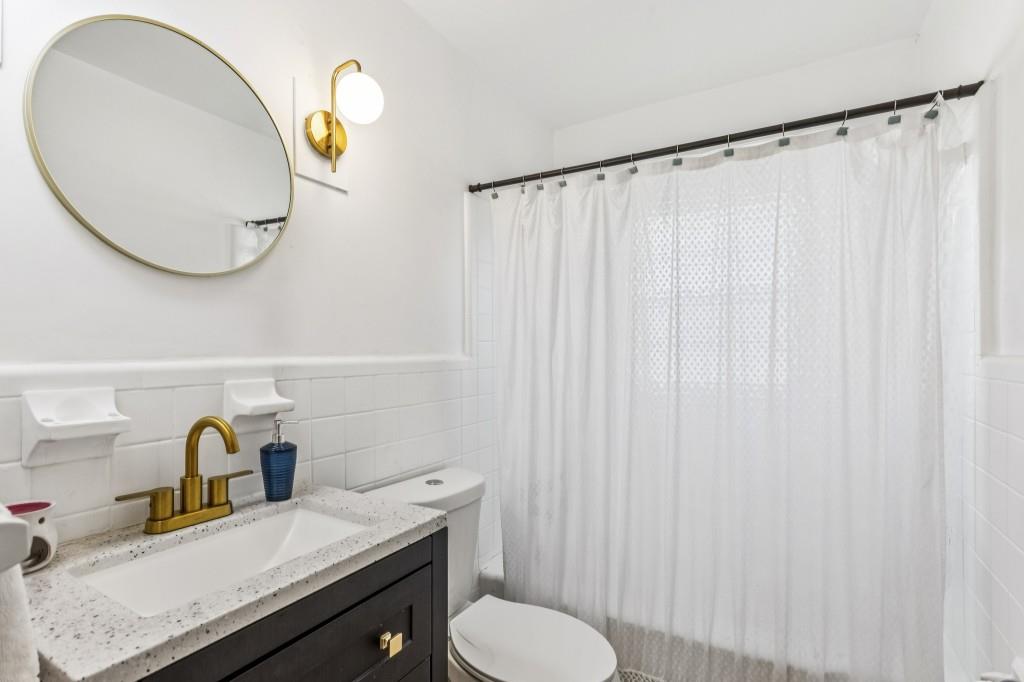 5430 Carol Circle Southwest Mableton, GA 30126 - Photo 21 of 32 a bathroom with a sink and a mirror
