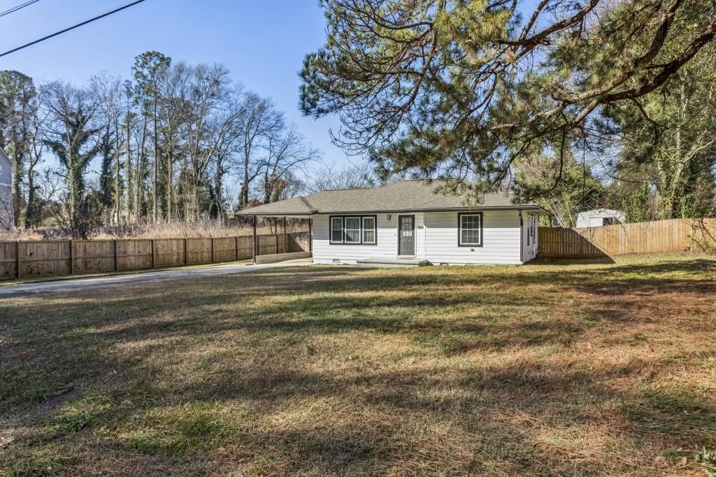 5430 Carol Circle Southwest Mableton, GA 30126 - Photo 32 of 32 a front view of a house with a yard