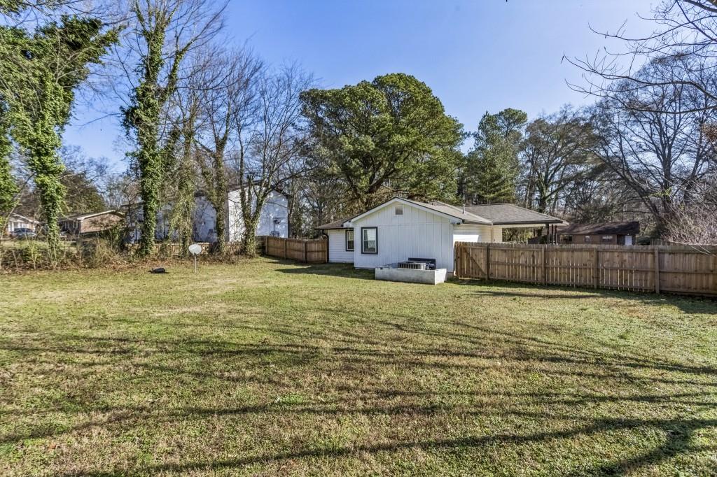 5430 Carol Circle Southwest Mableton, GA 30126 - Photo 5 of 32 a house view with a backyard space