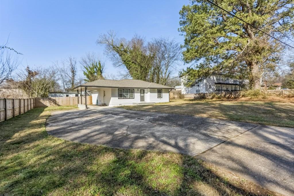 5430 Carol Circle Southwest Mableton, GA 30126 - Photo 8 of 32 a front view of a house with a garden