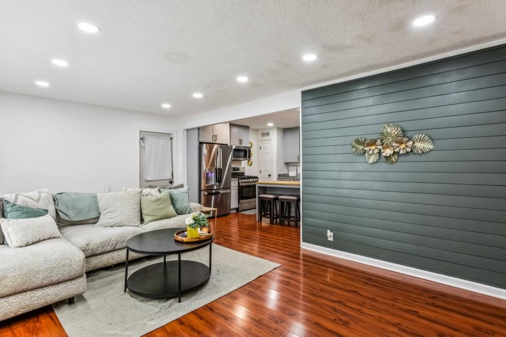 5430 Carol Circle Southwest Mableton, GA 30126 - Photo 10 of 32 a living room with furniture and wooden floor