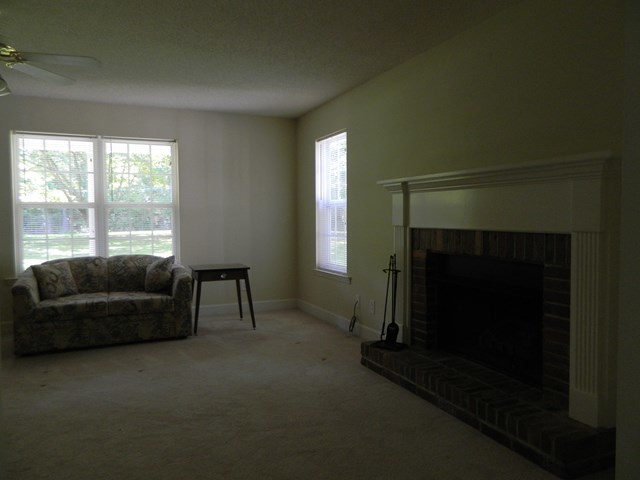 1625 Nowell Road West Macon, GA 31220 - Photo 11 of 21 a living room with furniture and a fireplace