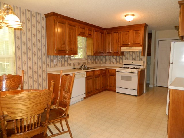 1625 Nowell Road West Macon, GA 31220 - Photo 12 of 21 a kitchen with a stove sink and cabinets