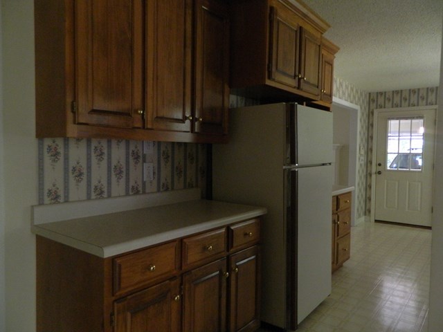 1625 Nowell Road West Macon, GA 31220 - Photo 15 of 21 a kitchen with stainless steel appliances granite countertop a refrigerator and cabinets